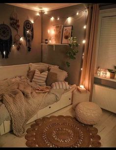 a bedroom with lights strung above the bed and rugs on the floor in front of it