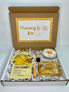 an open box containing various items for mother's day, including soaps and lotion