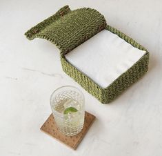 Spruce up your tabletop decor with these colorful Voru Lidded napkin holders, available in two sizes made from woven abaca and leather. These fun-colored napkin holders are suitable for outdoor use. Sold in a set of 2 Material: Abaca Fiber Finish: Green Size:Cocktail Napkin Holder: 6"L x 6.5"W x 3"HLuncheon Napkin Holder: 7.5"L x 8"W x 3"H Care: Not Dishwasher Safe, Not Microwave Safe, Not Oven Safe | Voru Green Napkin Holders (Set of 2) size 6"L x 6.5"W x 3" Abaca Fiber, Cocktail Napkin Holder, Green Napkins, Linen Dinner Napkins, Napkin Holders, Acrylic Decor, Tabletop Decor, Gift Items, Napkin Holder