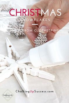 someone is making snowflakes out of paper and glue