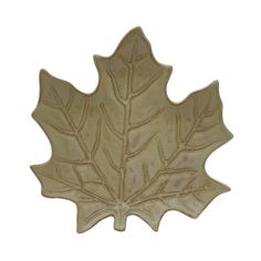 a leaf shaped dish is shown on a white background with the image of an oak leaf