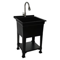 a black sink with a faucet on the side and a metal faucet