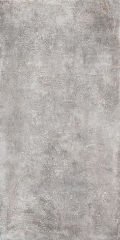 a gray area rug with an uneven design