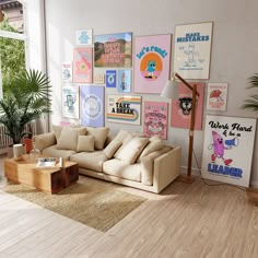 a living room filled with furniture and lots of posters on the wall next to a window