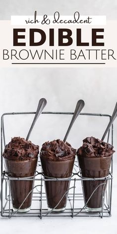 three chocolate brownie batter cups with spoons in them and the words edible on top