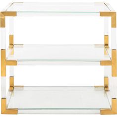 three tiered glass shelf with gold trimmings on the bottom and bottom shelves