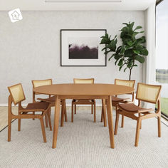 a dining room table with six chairs and a potted plant