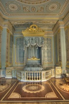 an ornate room with gold and blue decor