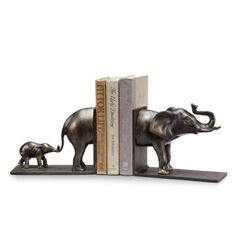 a bookend with an elephant and baby elephant standing on it's back legs