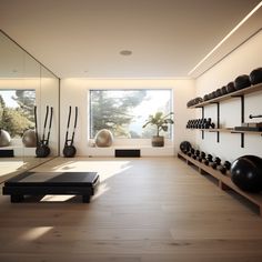 there is a large room with many exercise balls on the wall and yoga mats on the floor