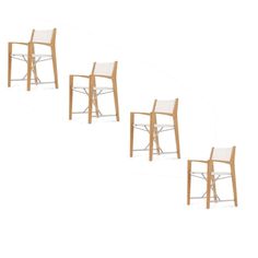 four wooden chairs sitting next to each other