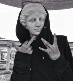 black and white photograph of a woman with her hands in the shape of a peace sign