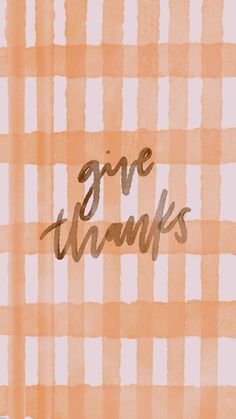 the words give thanks written in cursive writing on a checkered fabric background