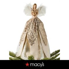 a christmas ornament with an angel on it's back and the words macy's above it