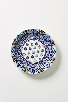 a blue and white plate sitting on top of a table