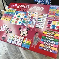 a large mickey mouse activity board on the floor