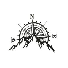 a black and white compass tattoo on a white background with mountains in the distance,