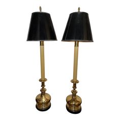 pair of brass table lamps with black shades