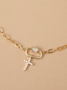 The delicate paperclip chain adds a modern edge, while the sparkling rhinestone cross pendant offers a symbol of faith. Perfect for layering with other necklaces or on its own, this necklace is a versatile must-have. Layering Cross Necklaces, Cross Layered Necklace, Altard State Necklaces, Layered Cross Necklace, Cross Charm Necklace, Necklace Stack, State Necklace, Stacked Necklaces, Rhinestone Cross