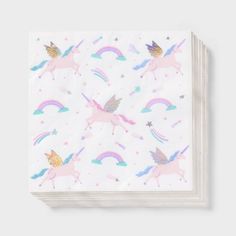 a napkin with unicorns and rainbows on the front, in pastel colors