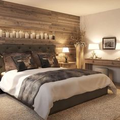 a large bed sitting next to a wooden wall