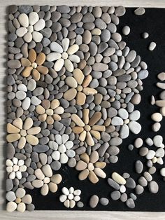 a painting made out of rocks and pebbles