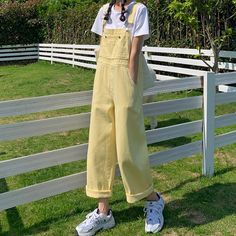 Light buttery yellow overalls with a high waist, relaxed straight leg fit. S: 33" waist, 43" hips, 12" rise, 25" thighs, 18.5" ankles, 23" inseamM: 34.5" waist, 44.5" hips, 12" rise, 25.5" thighs, 19" ankles, 23.5" inseamL: 36" waist, 46" hips, 12" rise, 26" thighs, 19.5" ankles, 24” inseamXL: 37.5" waist, 47.5" hips, 12" rise, 26.5" thighs, 20" ankles, 24.5" inseam How to attach buckles:Slide the rectangular buckle on first, followed by the T-shaped buckle. Overall straps will hold on its own a Yellow Overalls Outfits, Pastel Yellow Aesthetic Outfit, Yellow Outfit Inspo Aesthetic, Yellow Themed Outfits, Light Blue Overalls Outfit, Yellow Spring Overalls With Pockets, Spring Yellow Overalls With Pockets, Yellow Summer Overalls With Pockets, Yellow Wide Leg Cotton Jeans