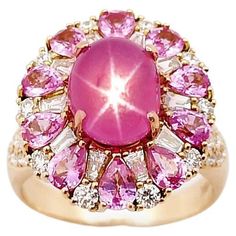 Unheated Star Pink Sapphire 4.80 carats, Pink Sapphire 1.75 carats and Diamond 0.83 carat Ring set in 18K Rose Gold Settings (Certified by GIT: Gem and Jewelry Institute of Thailand) Width: 1.5 cm Length: 1.8 cm Ring Size: 54 Total Weight: 8.46 grams Star Pink Sapphire Width: 0.7 cm Length: 0.9 cm "We first opened doors in 1980 when it was then situated in the vicinity of the Victory Monument; a small and modest storefront with a couple of counters. From its humble beginnings to where it stands today, our company has proven its abilities as a jeweler. Since the beginning, we have been supplying fine quality pieces to dealers, wholesalers and customers worldwide. From then till now, our business still interrelates its name with quality products and excellent service, where commitment and si Black Mermaid Dress, Pink Sapphire Diamond Ring, Black Mermaid, Pink Bling, Ruby Rose, Star Ruby, Diamond Ring Settings, Star Ring, Royal Jewelry