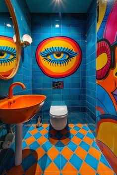 a bathroom with blue and orange tiles, an orange sink and a white toilet in it