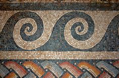 a close up of a mosaic on the floor