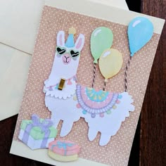 a card with an image of llamas and balloons