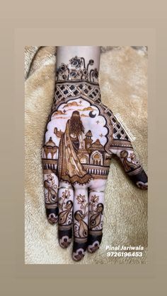 the hand is decorated with intricate designs