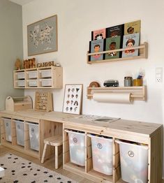 a room filled with lots of wooden shelves and bins