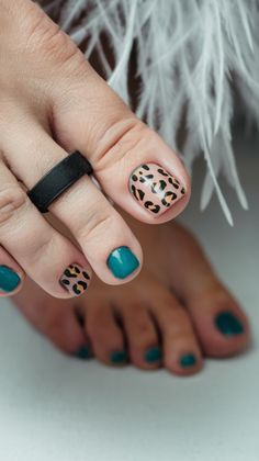 This pedicure mixes deep teal polish with a neutral base on the accent toe, with black and brown leopard spots for a daring yet polished look. The matching combination of solid and patterned nails makes this a great choice for spring toenail ideas that feel trendy yet versatile. The gel finish adds to the overall sleekness, making this a favourite for those who love a bold yet balanced pedicure. Toe Nail Designs For Spring, Spring Toenails, Nail Color Ideas Spring, Toe Nail Polish Ideas, Toenails Pedicure, Patterned Nails, Toenail Ideas, Toe Nail Ideas, Toe Nail Polish