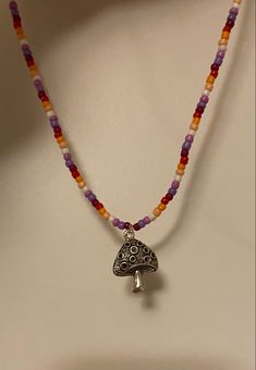 lesbian flag beaded necklace with mushroom charm Lesbian Necklace Beads, Pride Necklace Diy, Lesbian Beaded Necklace, Lesbian Pride Jewellery, Lesbian Jewelry Diy, Lesbian Crafts, Pride Jewelry Diy, Beaded Necklace Ideas, Lesbian Necklace