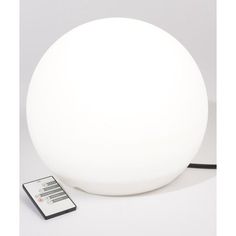 a white ball lamp with a remote control