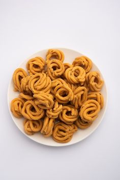 a plate full of pretzels on a white table