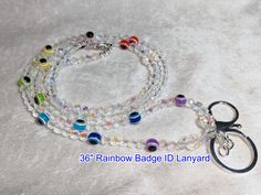 a multi - colored beaded lanyard with a pair of scissors