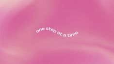 the word one stop at a time written in white on a pink background