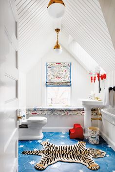 a bathroom with a tiger rug on the floor