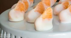 orange slices are arranged on top of white marshmallows