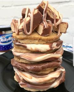 a stack of chocolate and marshmallows on top of each other with ice cream