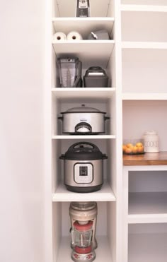 the shelves are filled with pots, containers and other kitchen items for cooking or baking