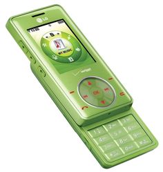 a green cell phone sitting on top of a white surface