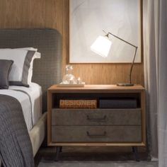 a bedroom with a bed, night stand and nightstand