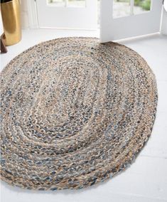 a round rug on the floor in front of a door