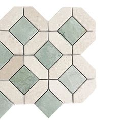 a white and green mosaic tile pattern on the floor, with small squares in each corner