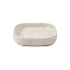 a small white bowl with speckles on it