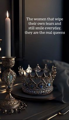 a crown and candle on a table with a quote about women that wipe their own tears and still smile everyday, they are the real queens