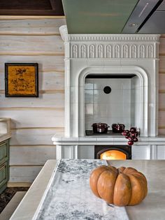 two pumpkins are sitting on the kitchen counter